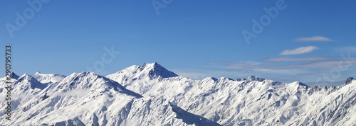 Panoramic view on snowy mountains in sunny day © BSANI
