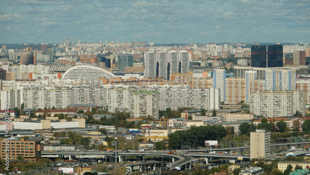 Moscow cityscape. Urban houses against the blue cloudy sky