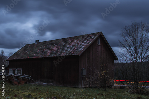 Long exposure of a barn by a road