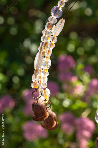 Garden ornament hanging with glass ans bell
