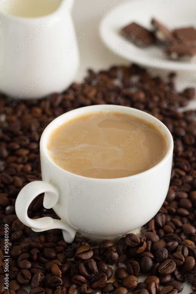 cup of coffee and beans on wooden background cup of coffee and beans on wooden background