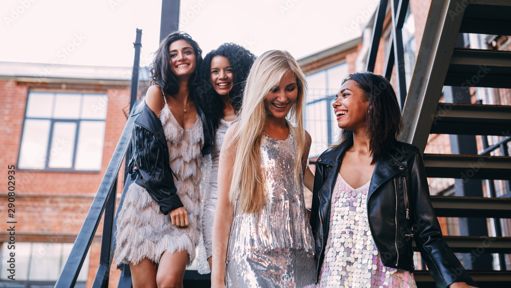 custom made wallpaper toronto digitalFour young girls go down the stairs. Young friends walking outdoors.