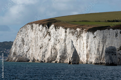 Studland, Dorset, England, UK. September 2019. White chalk cliffs of the Isle of Purbeck viewed from the sea. Ballard Down and the SW Coast Path