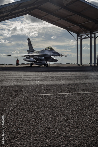 Fighter jet on the runway with pilot preparing for takeoff