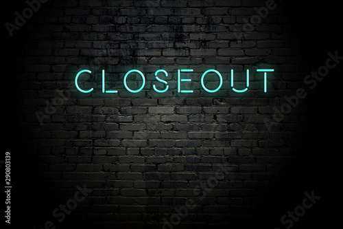 Highlighted brick wall with neon inscription closeout photo