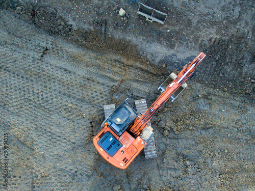 Construction excavator aerial bird's eye view 