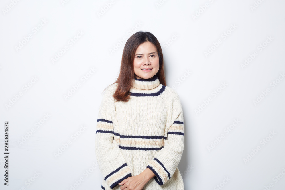 Happy beautiful asian woman in Christmas wearing in sweater studio shot isolated on gray background.banner with copy space Happy beautiful asian woman in Christmas wearing in sweater studio shot isolated on gray background.banner with copy space