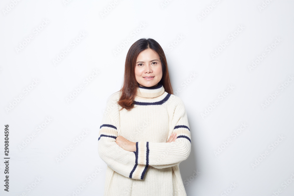 Happy beautiful asian woman in Christmas wearing in sweater studio shot isolated on gray background.banner with copy space Happy beautiful asian woman in Christmas wearing in sweater studio shot isolated on gray background.banner with copy space