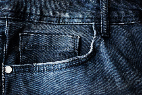 Foto Small fifth pocket on gray jeans close-up