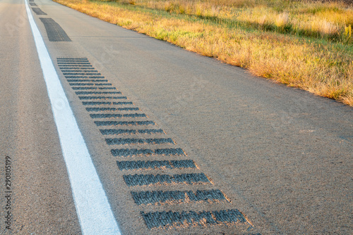 safety rumble strips on a highway shoulder