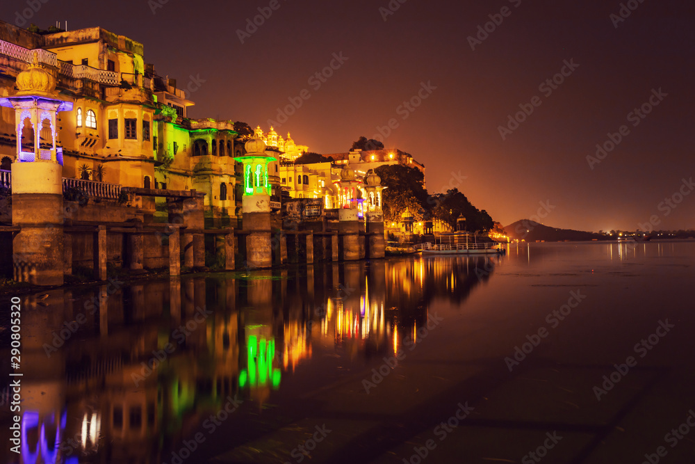 Old architecture historical buildings at the banks of lake pichola in Udaipur Rajasthan, India