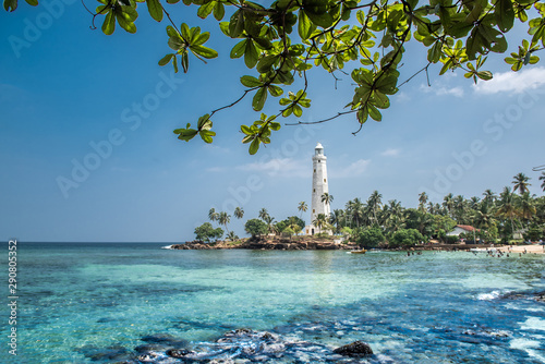 Lighthouse and beautiful beach landscape in Sri Lanka photo