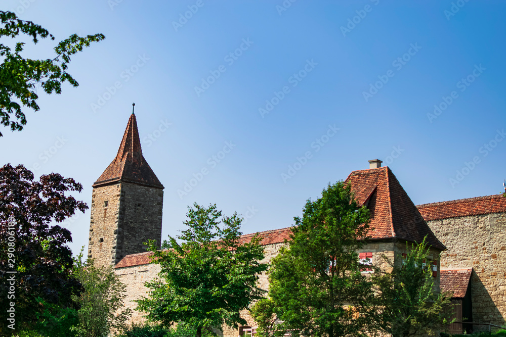 Part of the outer city wall with reddish roofs. Photograph taken in Rothenburg ob der Tauber, Bavaria, Germany. Part of the outer city wall with reddish roofs. Photograph taken in Rothenburg ob der Tauber, Bavaria, Germany.