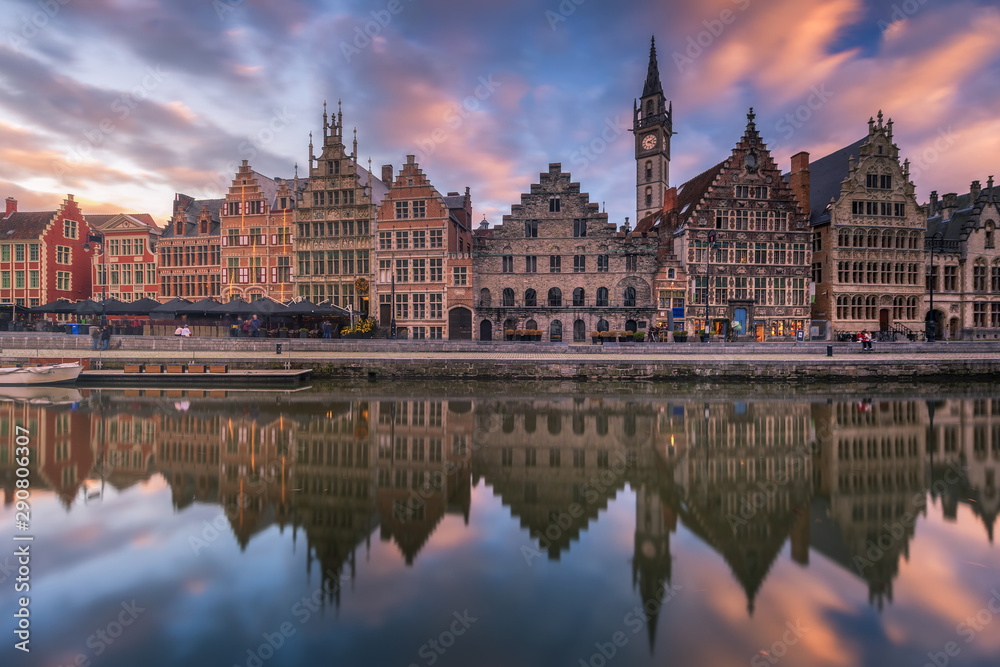 Facade of historical building with reflection with vibrant sky at Gent, Belgium