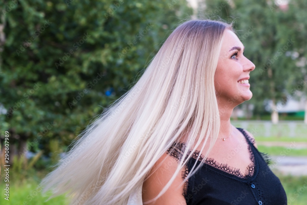 Portrait of a beautiful young woman with long shiny blond hair. Hair care concept. Portrait of a beautiful young woman with long shiny blond hair. Hair care concept.