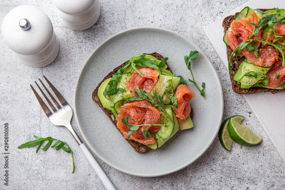 toast with dark rye bread, avocado, smoked salmon and cucumber toast with dark rye bread, avocado, smoked salmon and cucumber