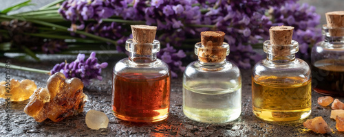 Panoramic header of essential oil bottles, frankincense and lavender