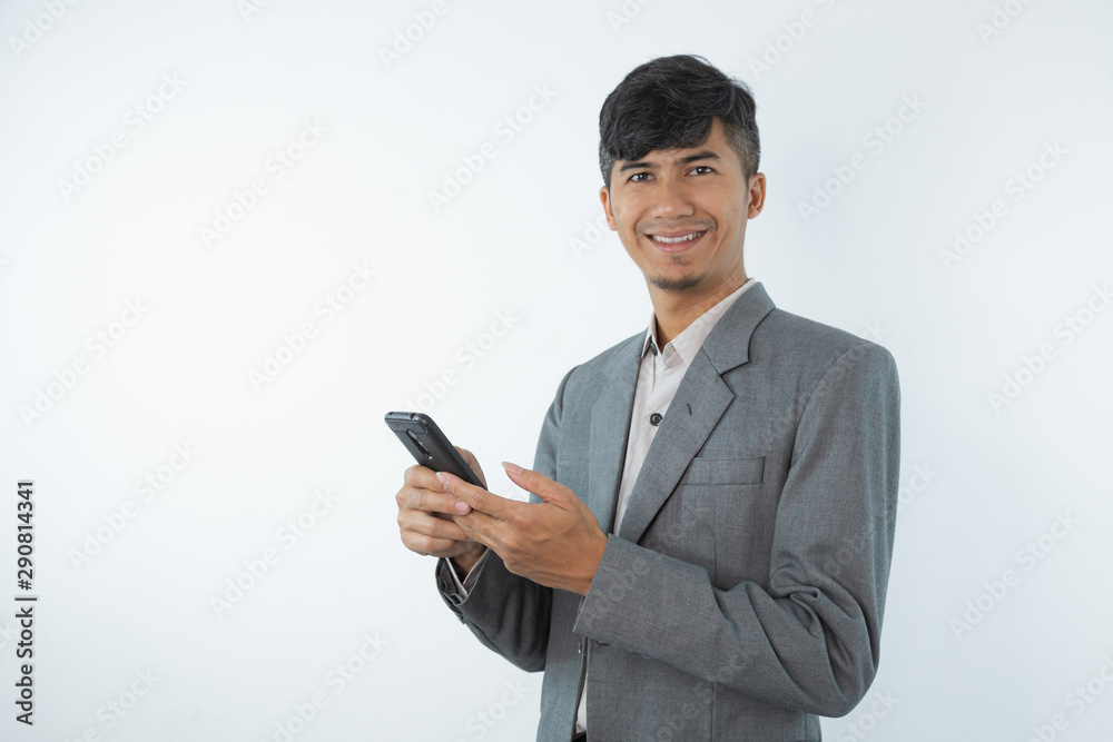 Portrait of asian young business man using smart cell phone isolated on white background. Portrait of asian young business man using smart cell phone isolated on white background.