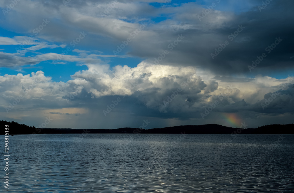 clouds and rainbow on the sea