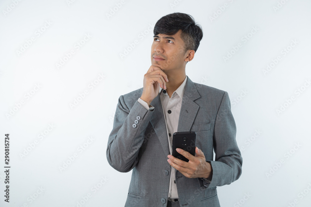 Young business asian man thinking of an idea isolated on white background. Young business asian man thinking of an idea isolated on white background.