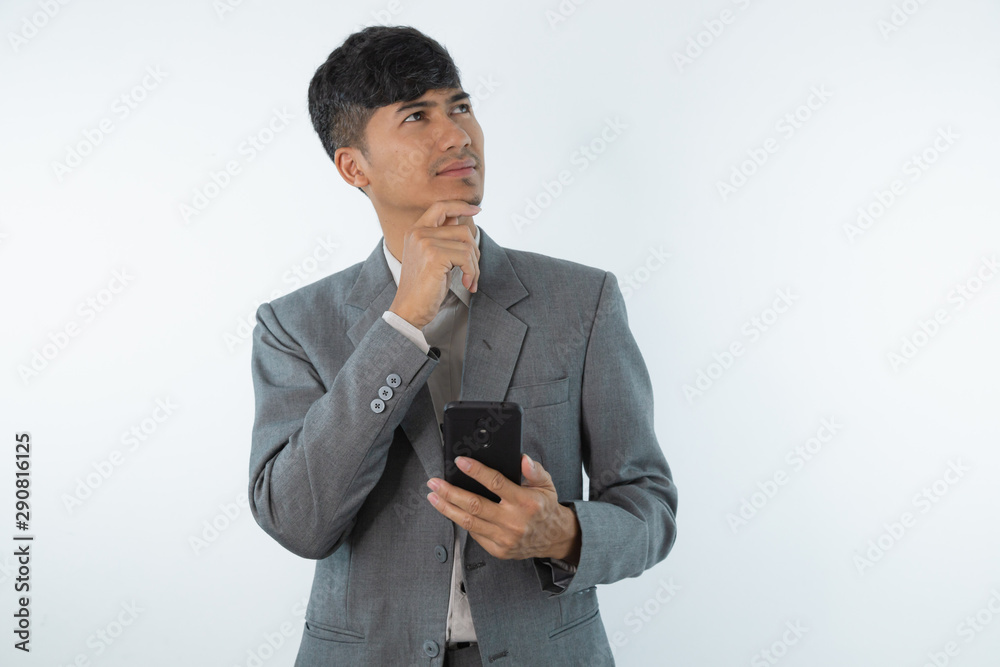 Young business asian man thinking of an idea isolated on white background. Young business asian man thinking of an idea isolated on white background.