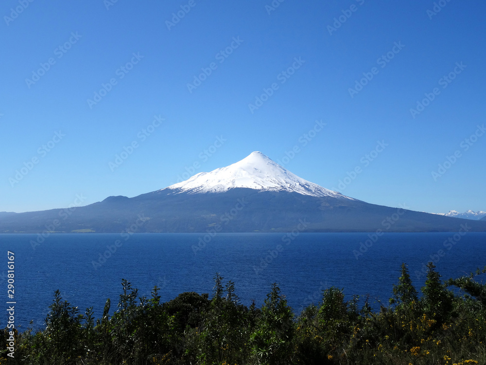 Beautiful view of a volcano with snow and the lake below. Puerto Varas, Chile Beautiful view of a volcano with snow and the lake below. Puerto Varas, Chile