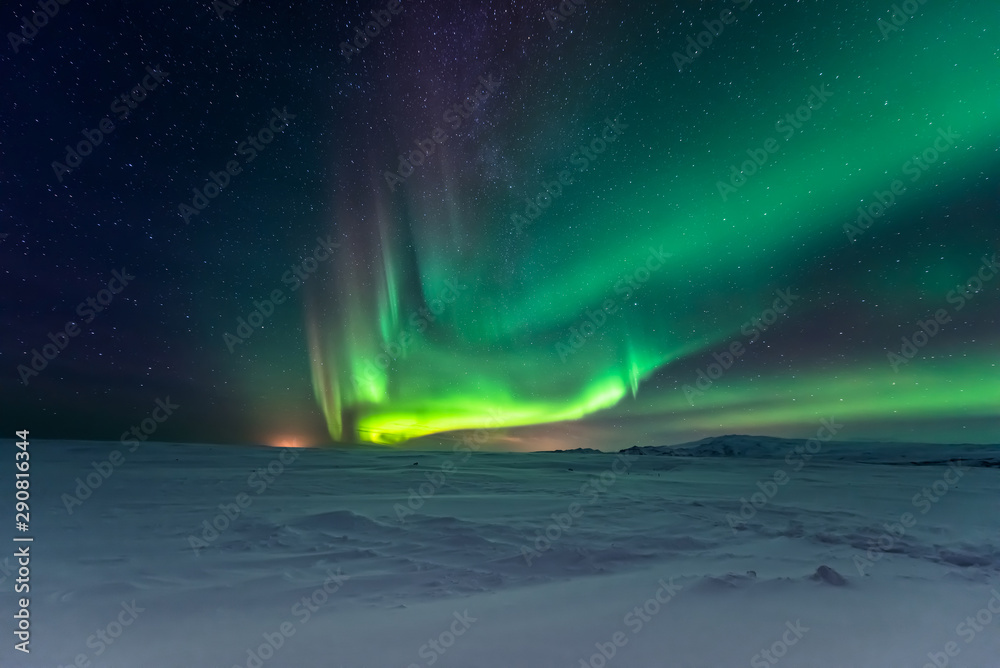 Northern lights aurora borealis in the winter 