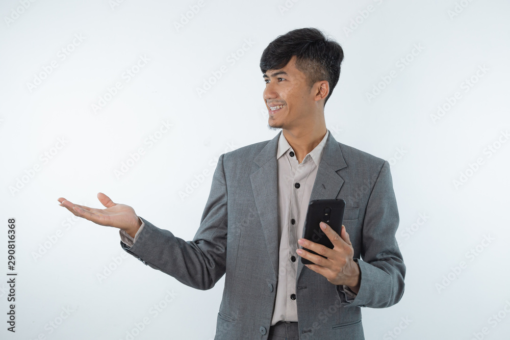 Business asian man showing something on the palm of his hand on white isolated background Business asian man showing something on the palm of his hand on white isolated background