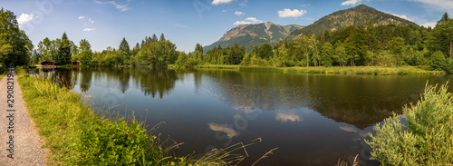 High resolution stitched panorama of a beautiful alpine view with a lake with mountain reflections at Oberstdorf, Bavaria, Germany