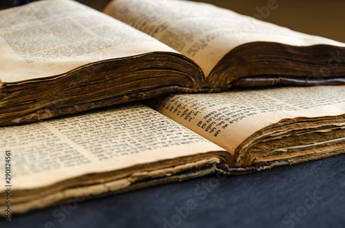 Jewish Bible. An open old Jewish books. Opened scripture pages. Selective focus. Closeup of hebrew text photo
