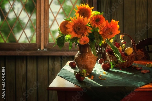 Rural still life with bouquet of sunflowers photo