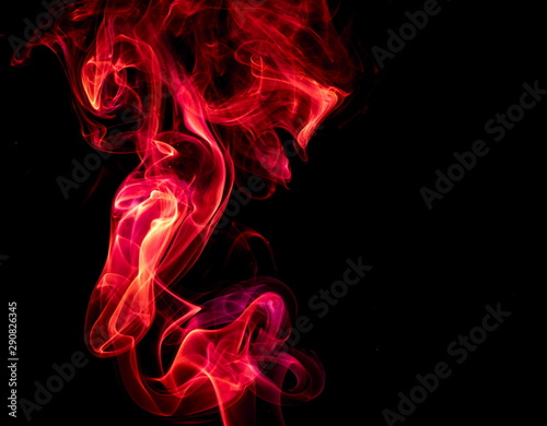 Red smoke on black background © yauhenka