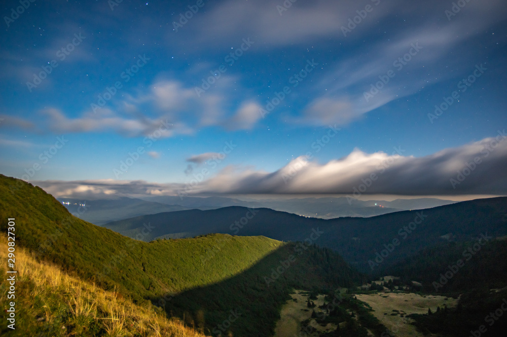 Panorama of the starry sky over the foggy mountains Panorama of the starry sky over the foggy mountains