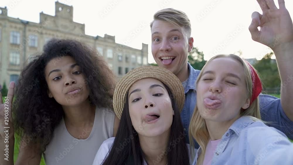 Happy and smiling friends taking selfies outdoors. Slowmotion. Happy and smiling friends taking selfies outdoors. Slowmotion.