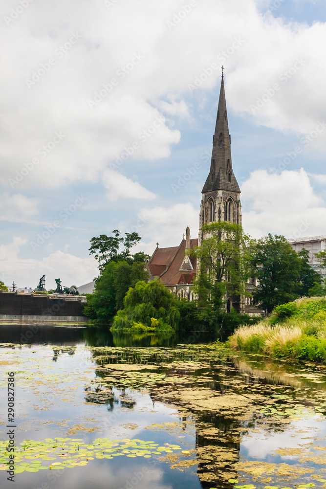 A view of St Alban's Church in Copenhagen, often referred to as the English Church, from across the moat of Kastellet fortress. Copenhagen. Denmark