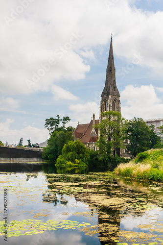 A view of St Alban's Church in Copenhagen, often referred to as the English Church, from across the moat of Kastellet fortress. Copenhagen. Denmark