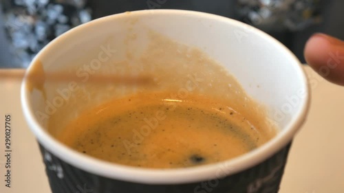 Woman hands pouring sticker sugar to the cup in cafe.