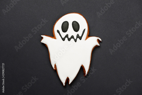 The hand-made eatable gingerbread Halloween ghost on black background photo