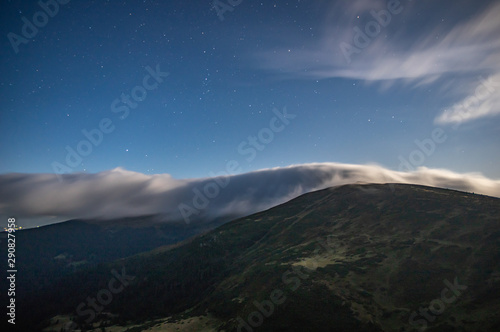 Panorama of the starry sky over the foggy mountains © onyx124