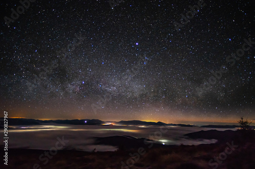 Panorama of the starry sky over the foggy mountains © onyx124