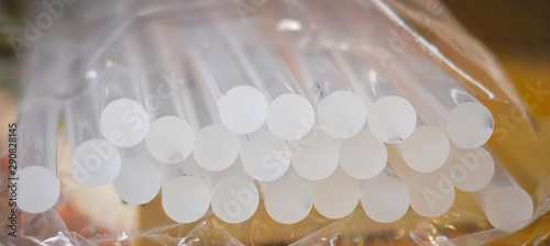 Hot glue for glue gun. Tool for gluing materials.