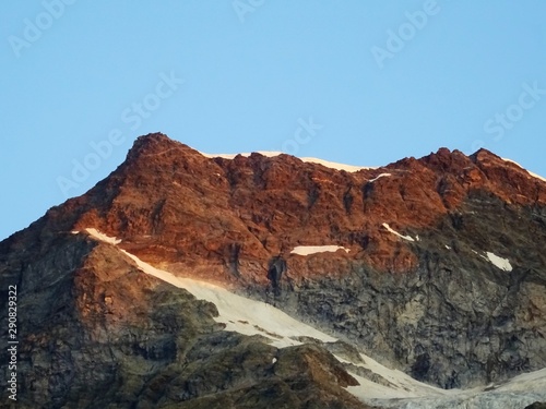 The "Monte Rosa", and the mountains of the Anzasca valley during sunrise on a summer day near the town of Macugnaga, Italy - August 2019.