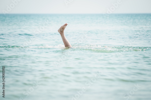 Man s leg sticking out of the water