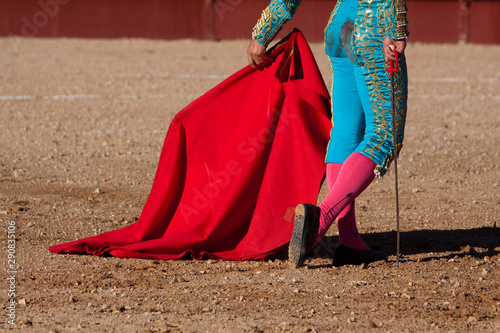 Spainish bullfighter walking slowly toward the bull to give the next pass with the muleta in the Bullring, Spain