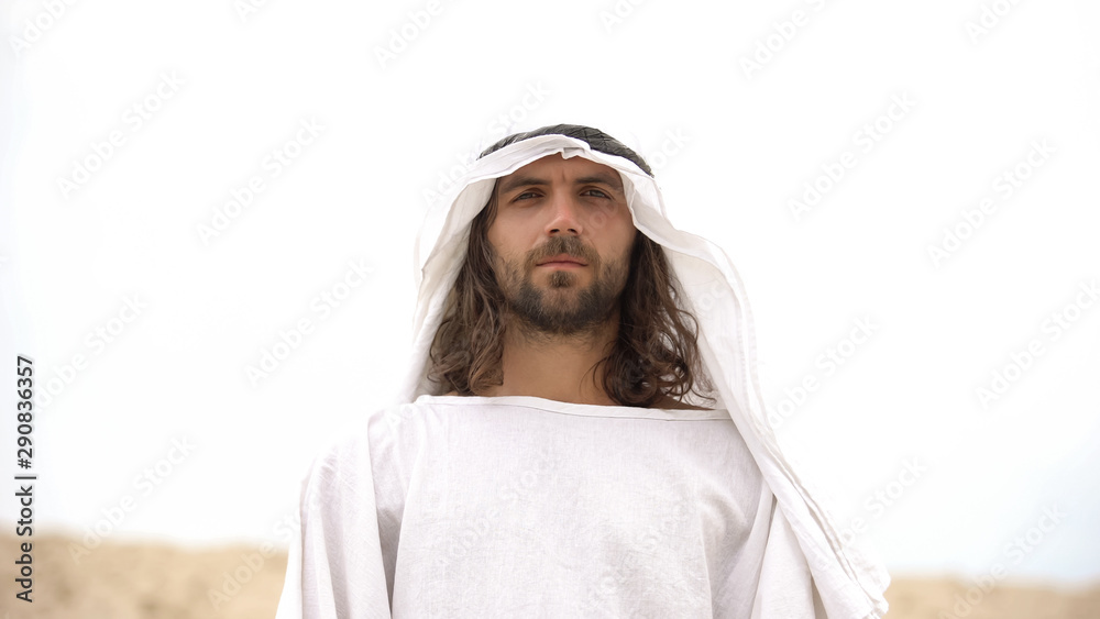 Bedouin in keffiyeh looking into camera, arab traditions and culture, islam Bedouin in keffiyeh looking into camera, arab traditions and culture, islam