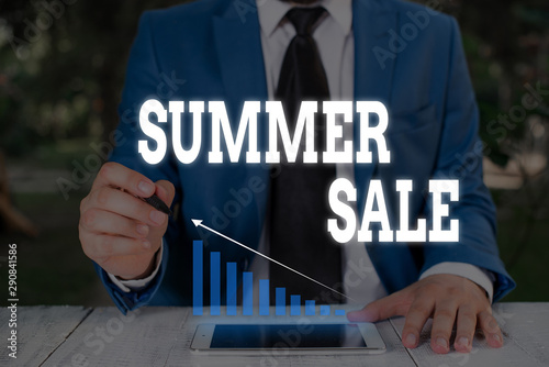 Handwriting text writing Summer Sale. Conceptual photo Annual discount events that takes place during summer season Male human wear formal work suit presenting presentation using smart device © Artur