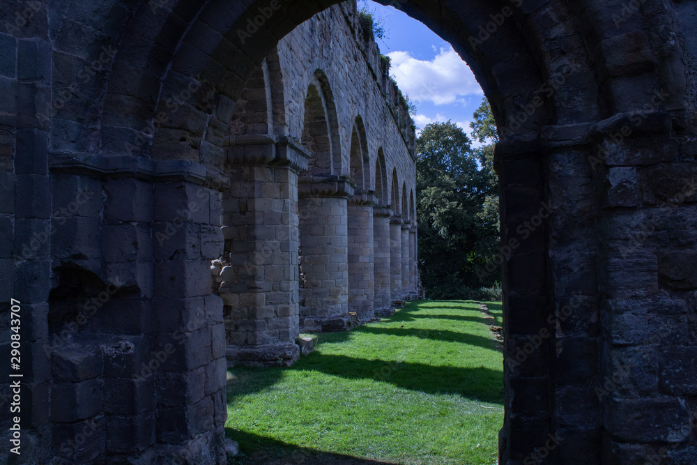 Colonnade ruins through hallway