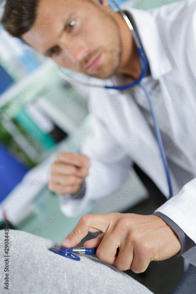 doctor examining the patients breathing doctor examining the patients breathing