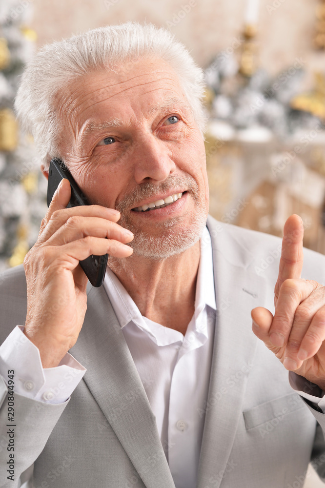 Portrait of senior businessman talking on phone Portrait of senior businessman talking on phone