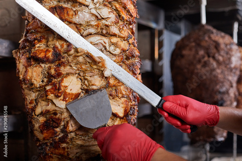 Fried meat on a skewer for cooking of donors or shawarma. Close-up